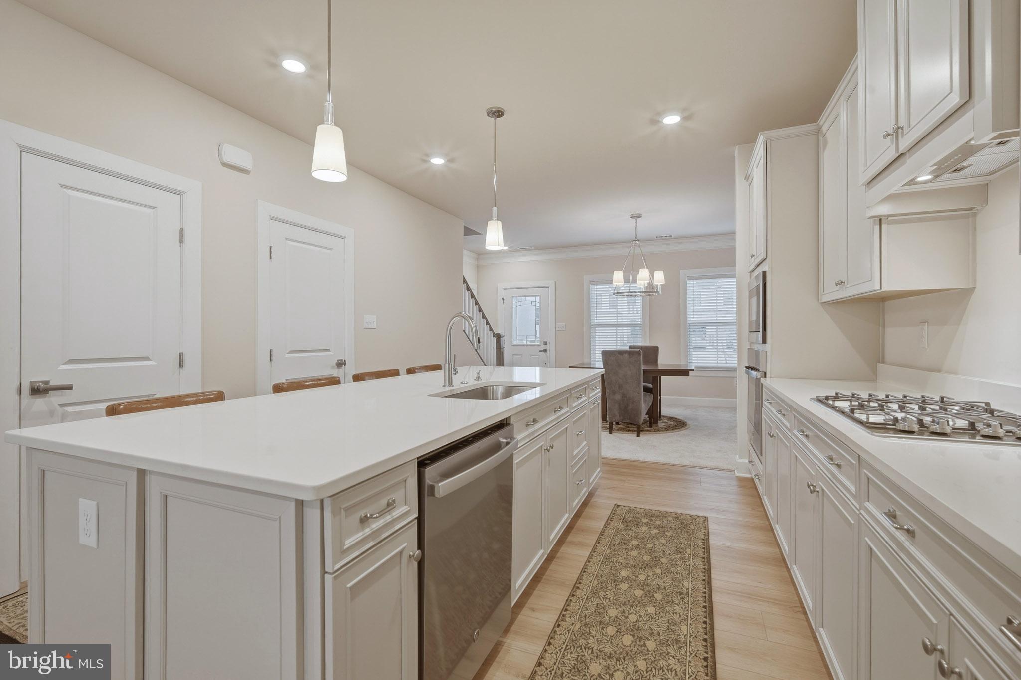 303 Southgate Road Cape May Court House, NJ 08210 - Photo 6 of 25 a large kitchen with a stove and a sink