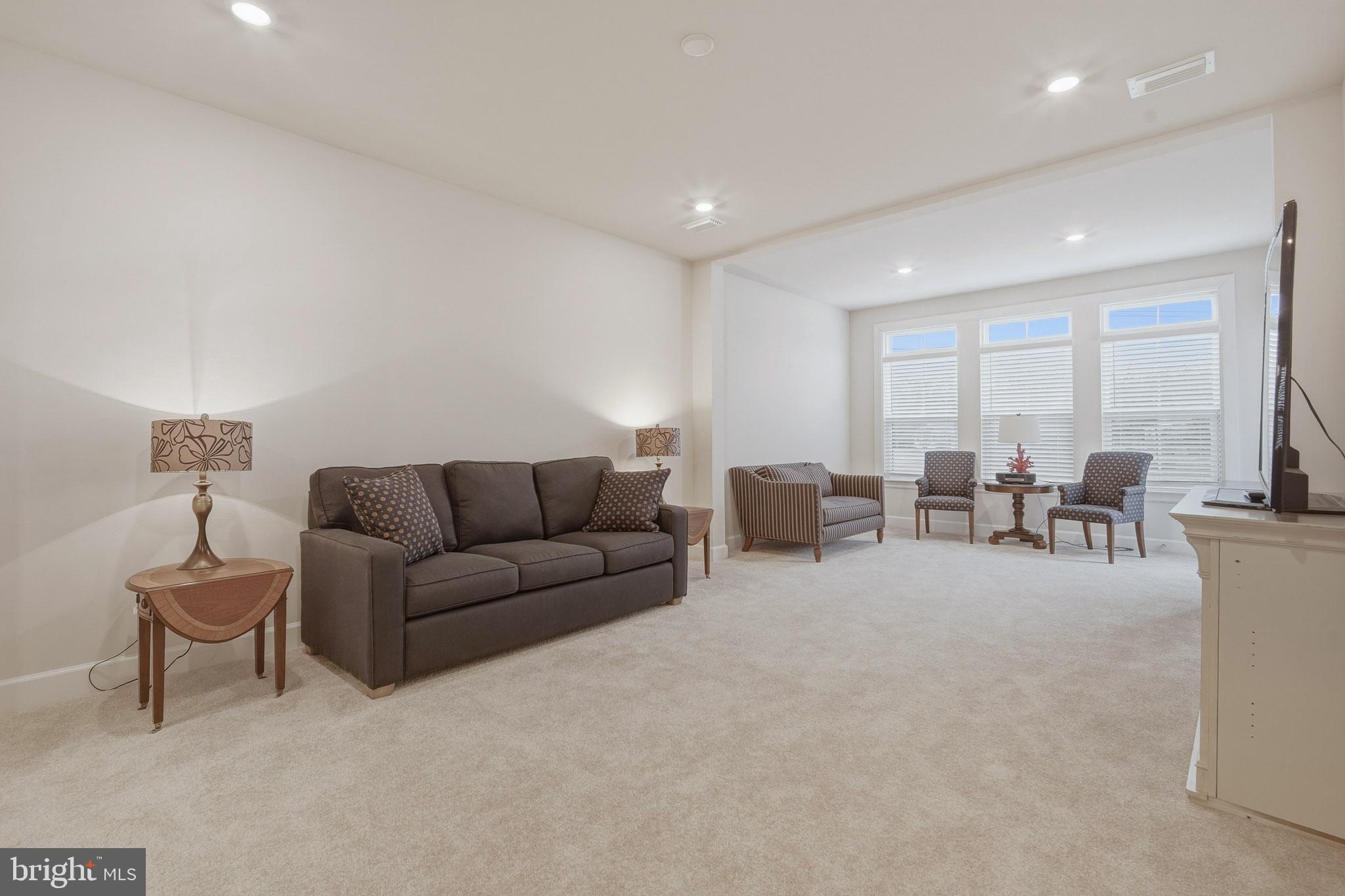 303 Southgate Road Cape May Court House, NJ 08210 - Photo 7 of 25 a living room with furniture and large windows
