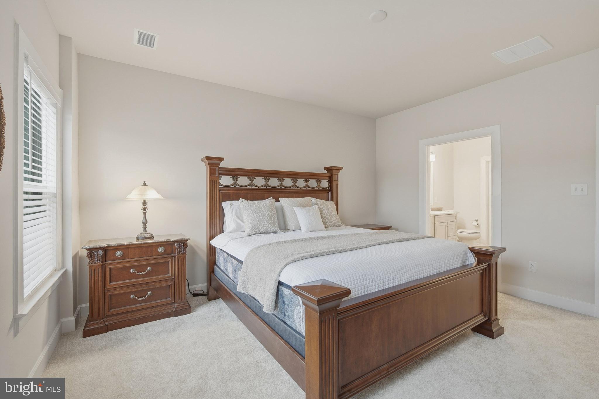 303 Southgate Road Cape May Court House, NJ 08210 - Photo 10 of 25 a bedroom with a bed and a night stand