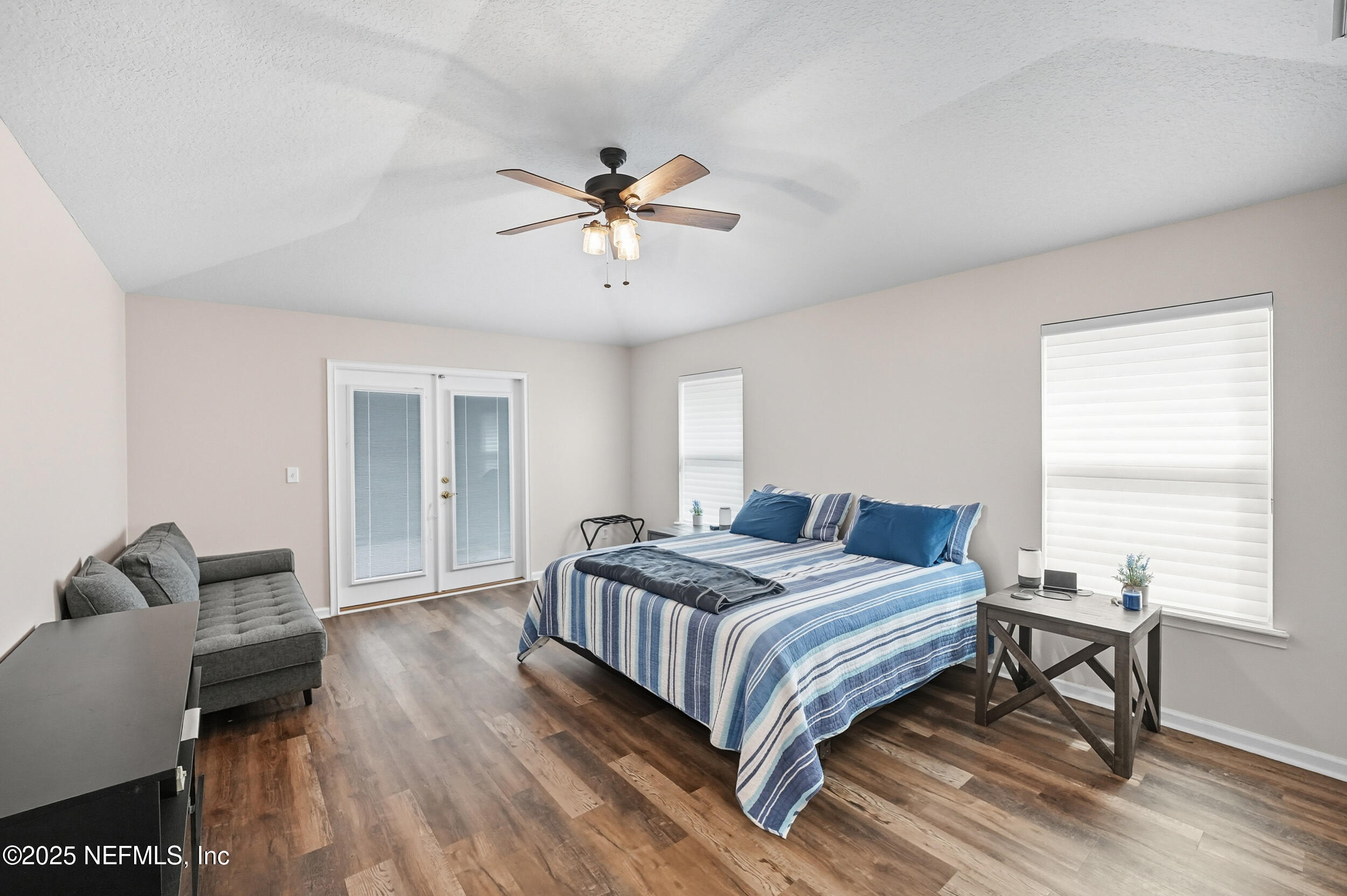 3761 Golden Reeds Lane Jacksonville, FL 32224 - Photo 13 of 40 a bedroom with a bed and wooden floor