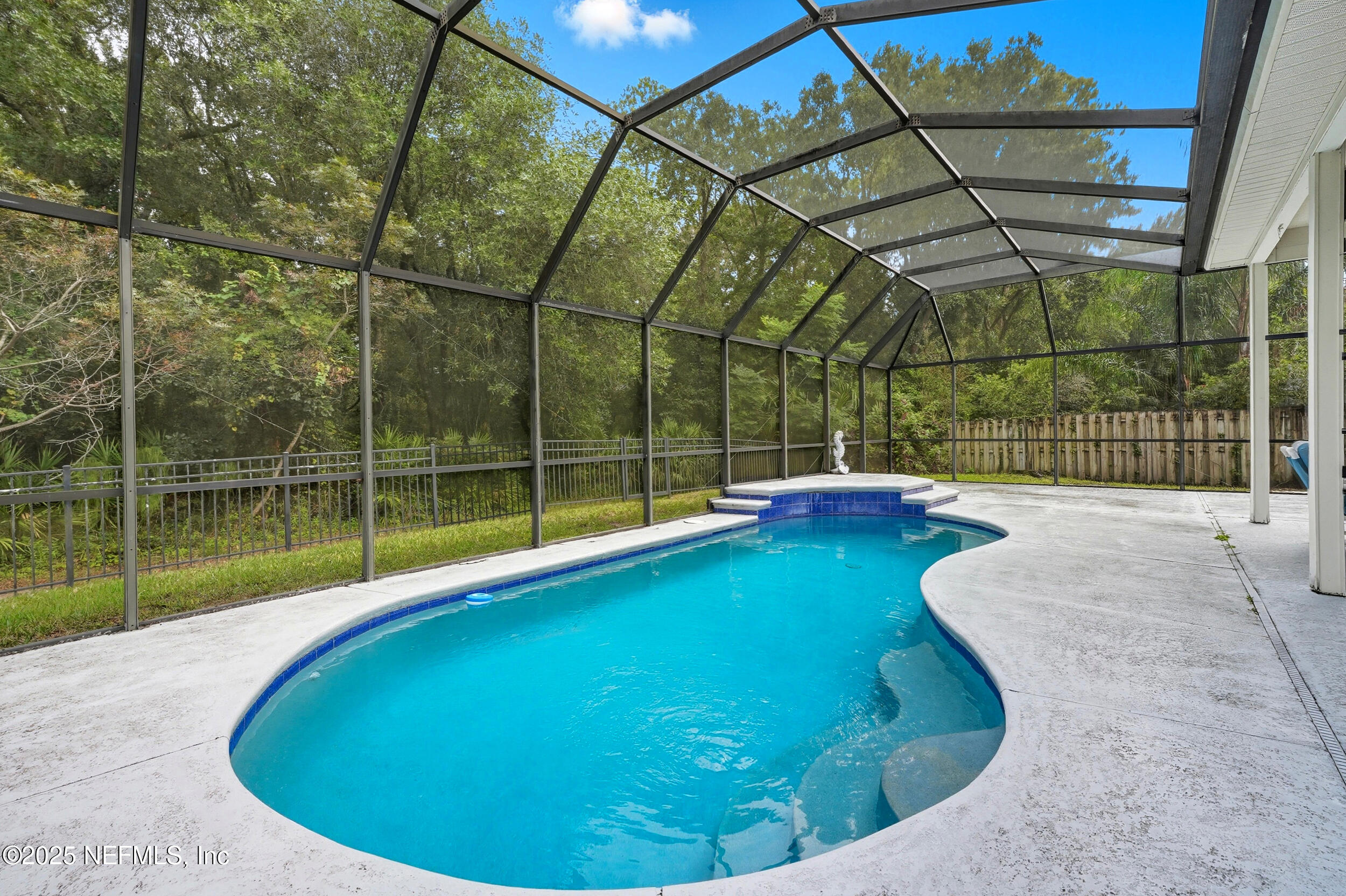 3761 Golden Reeds Lane Jacksonville, FL 32224 - Photo 25 of 40 a view of a backyard with a swimming pool
