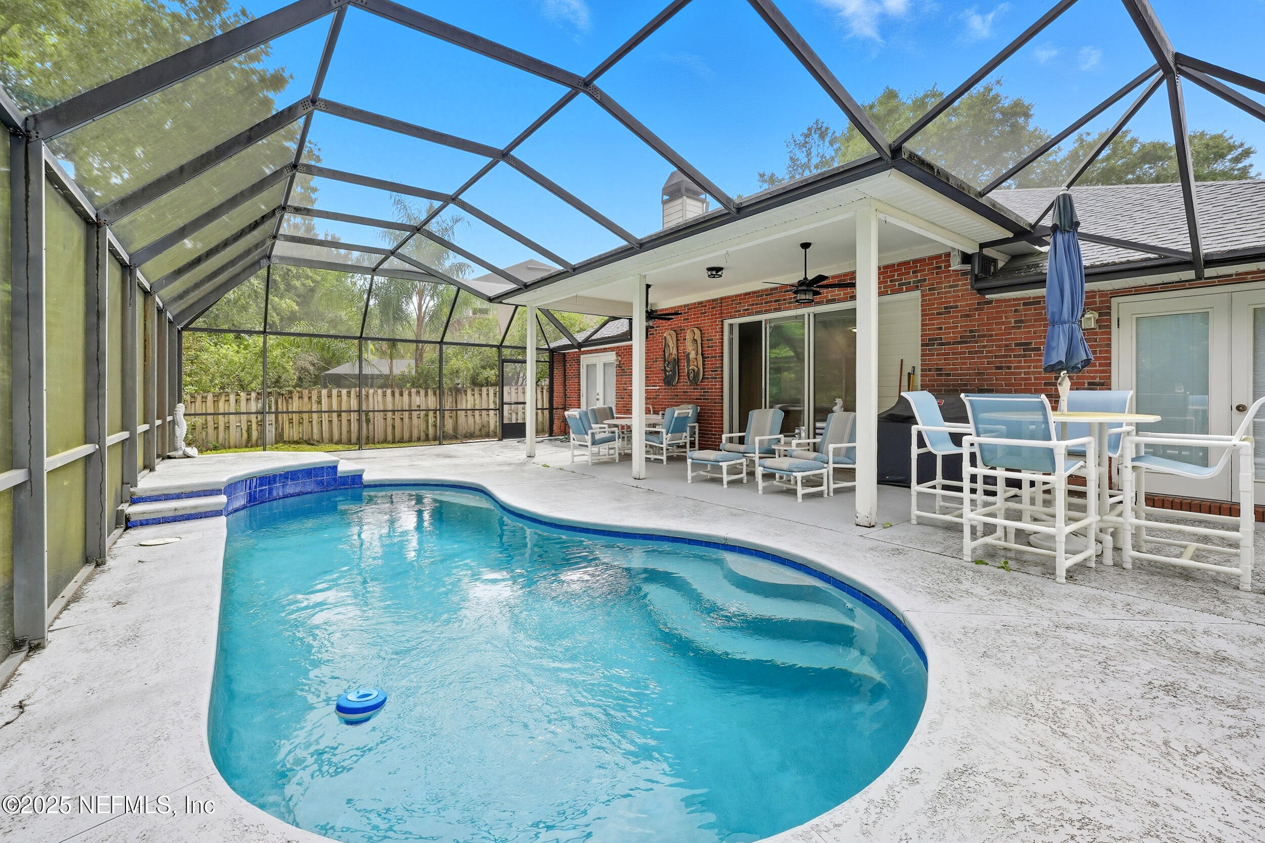 3761 Golden Reeds Lane Jacksonville, FL 32224 - Photo 26 of 40 a view of a swimming pool with outdoor seating