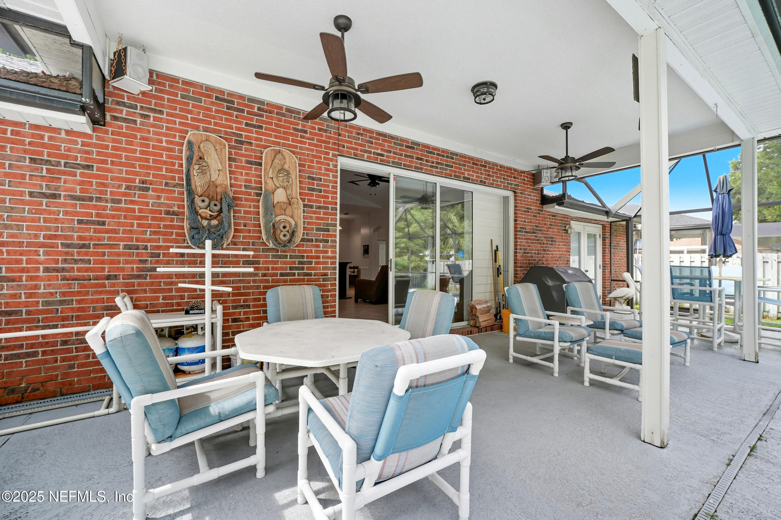 3761 Golden Reeds Lane Jacksonville, FL 32224 - Photo 27 of 40 a view of a dining room with furniture wooden floor and a chandelier