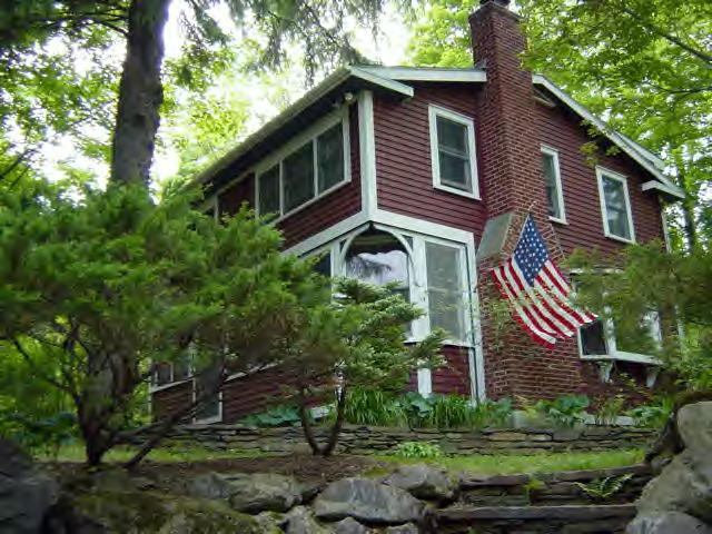 5 Christian Hill Road Stockbridge, MA 01262 - Photo 1 of 8 a front view of a house with a yard