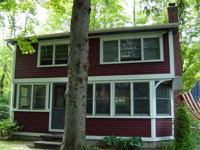 5 Christian Hill Road Stockbridge, MA 01262 - Photo 2 of 8 a view of brick house with large windows