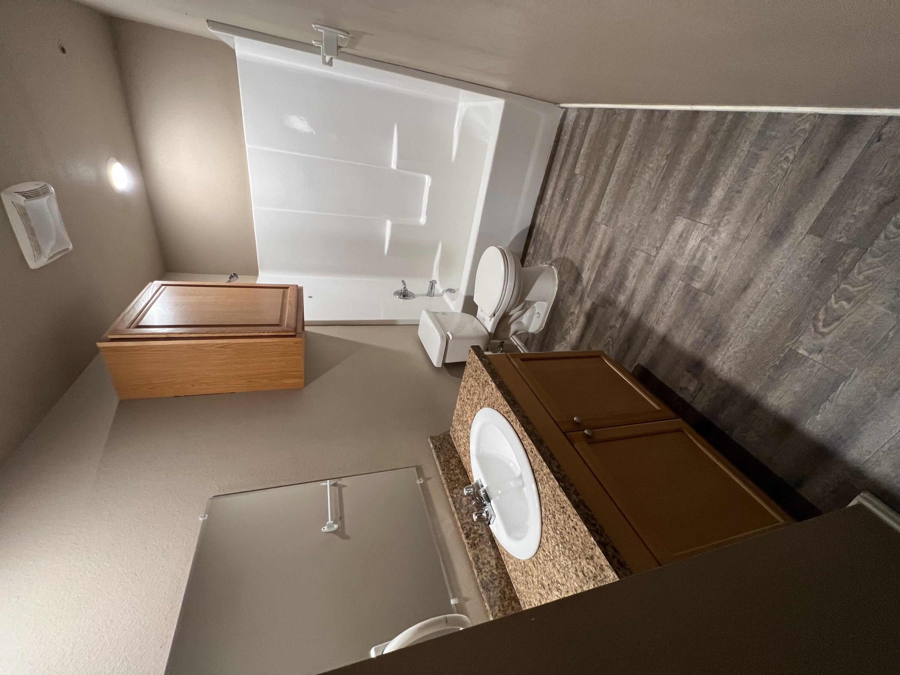 2914 East Cornell Street Lubbock, TX 79403 - Photo 5 of 18 a bathroom with a sink and a mirror