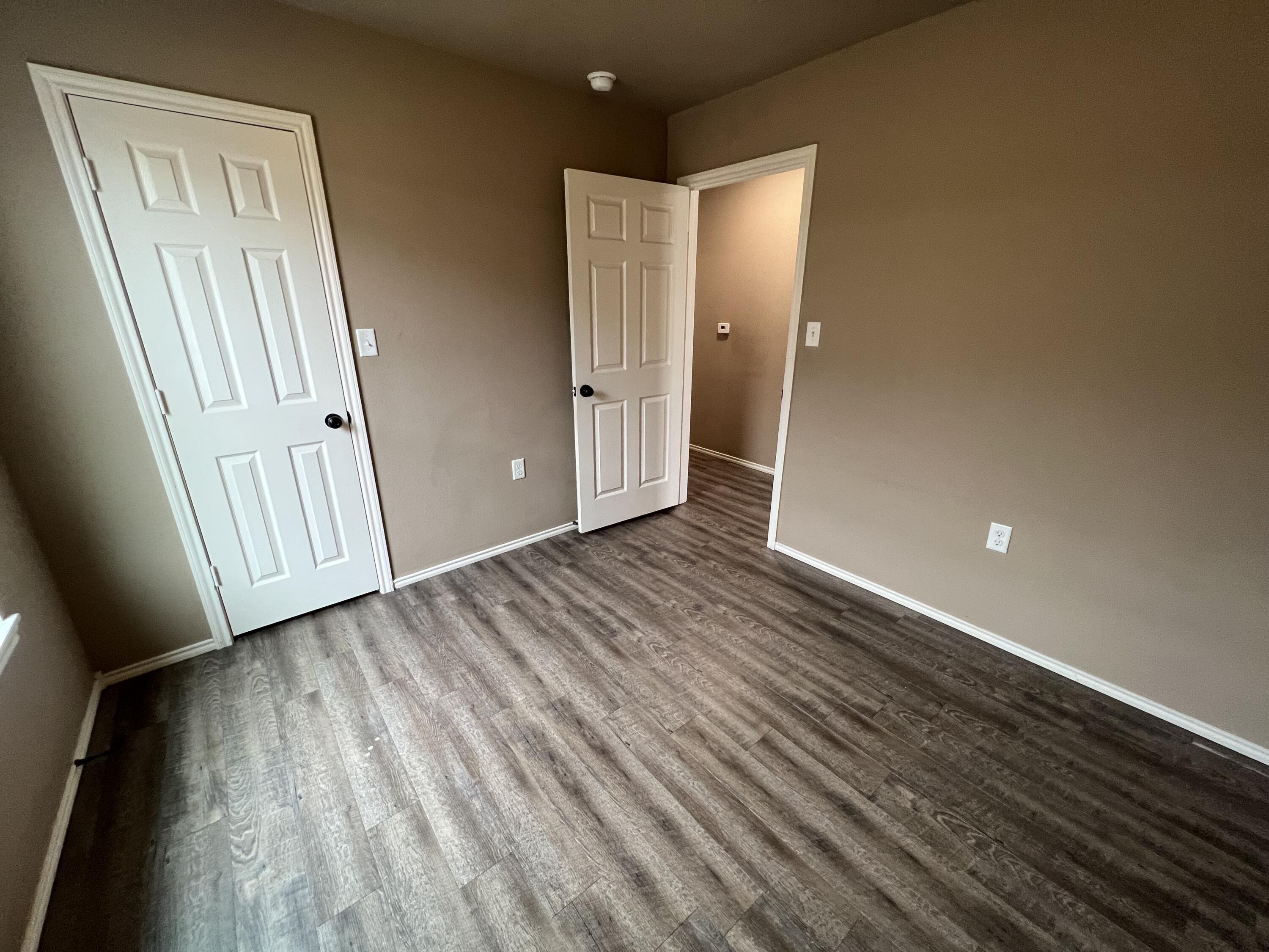 2914 East Cornell Street Lubbock, TX 79403 - Photo 9 of 18 a view of a livingroom with wooden floor and stairs