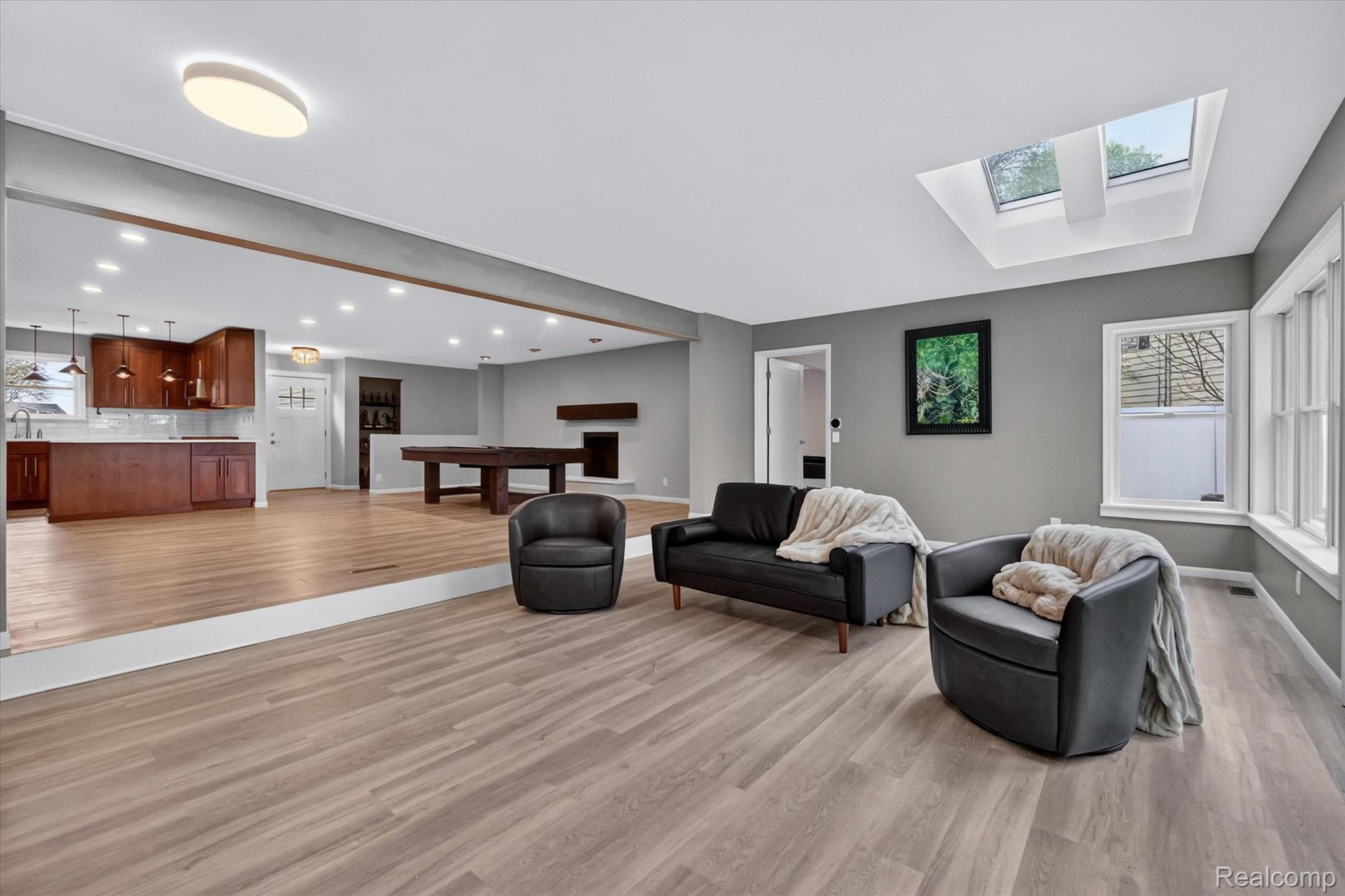 2264 Crane Road Fenton, MI 48430 - Photo 22 of 55 Living room with light wood-style floors, billiards table, and a skylight