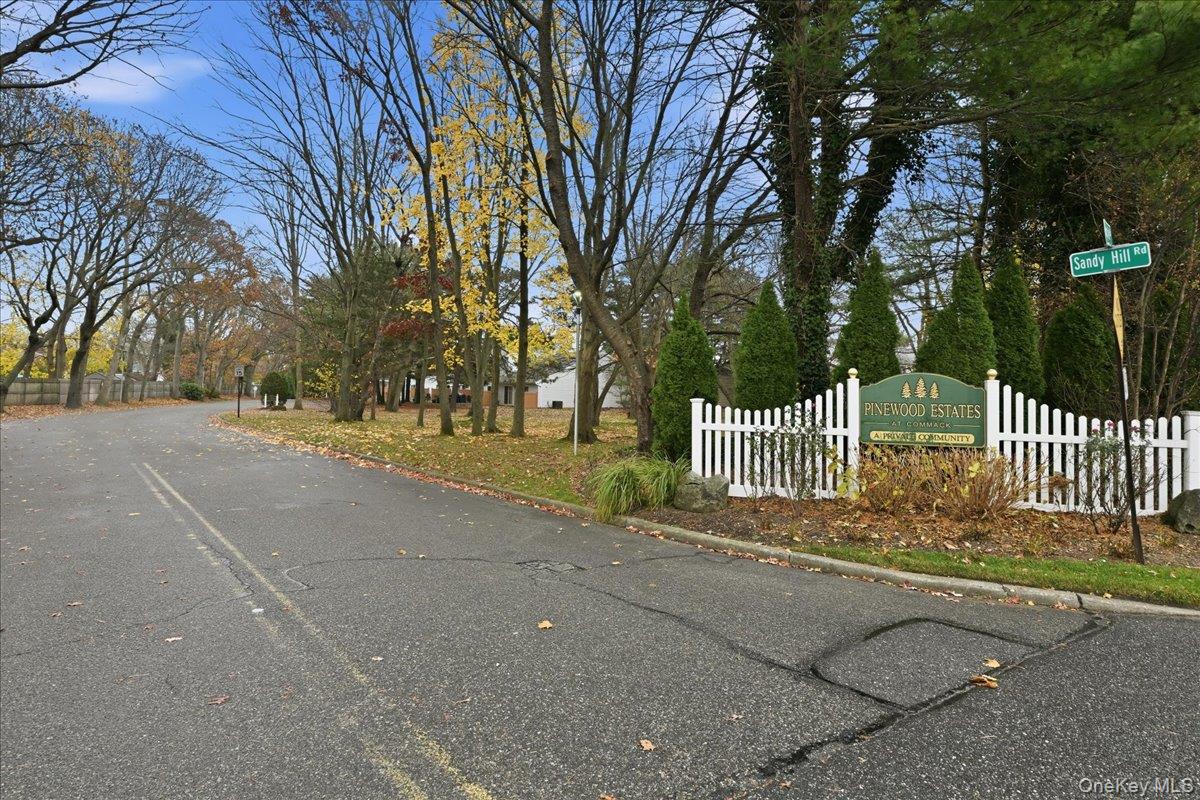23 Sandy Hill Road Commack, NY 11725 - Photo 2 of 24 a view of street along with trees