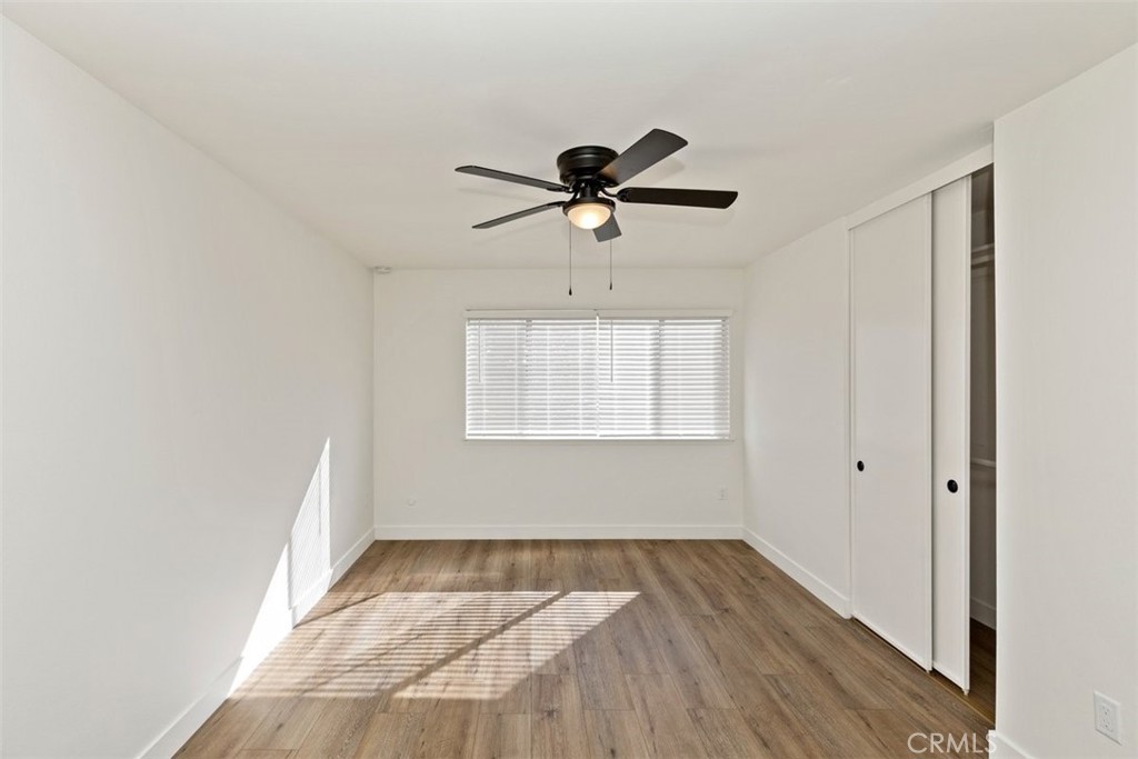 4807 Jackson Street, Unit D Riverside, CA 92503 - Photo 20 of 38 a view of empty room with wooden floor and fan