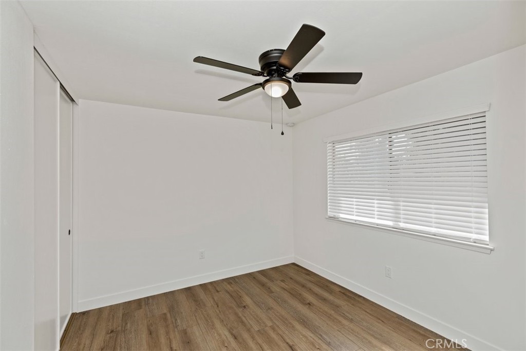 4807 Jackson Street, Unit D Riverside, CA 92503 - Photo 22 of 38 a view of empty room with wooden floor and fan