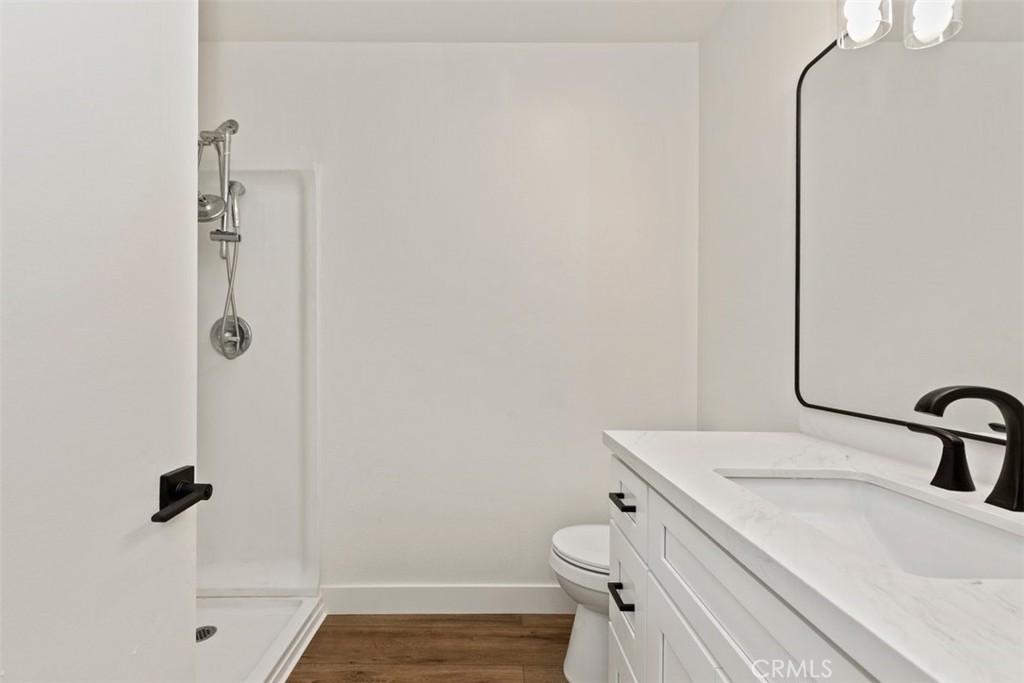 4807 Jackson Street, Unit D Riverside, CA 92503 - Photo 24 of 38 a bathroom with a sink a toilet and shower