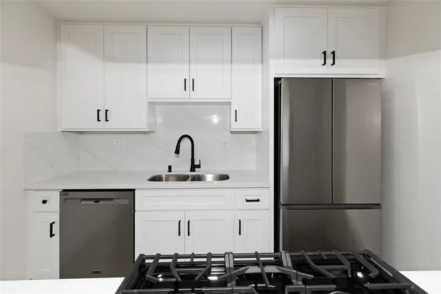 a kitchen with a sink and cabinets