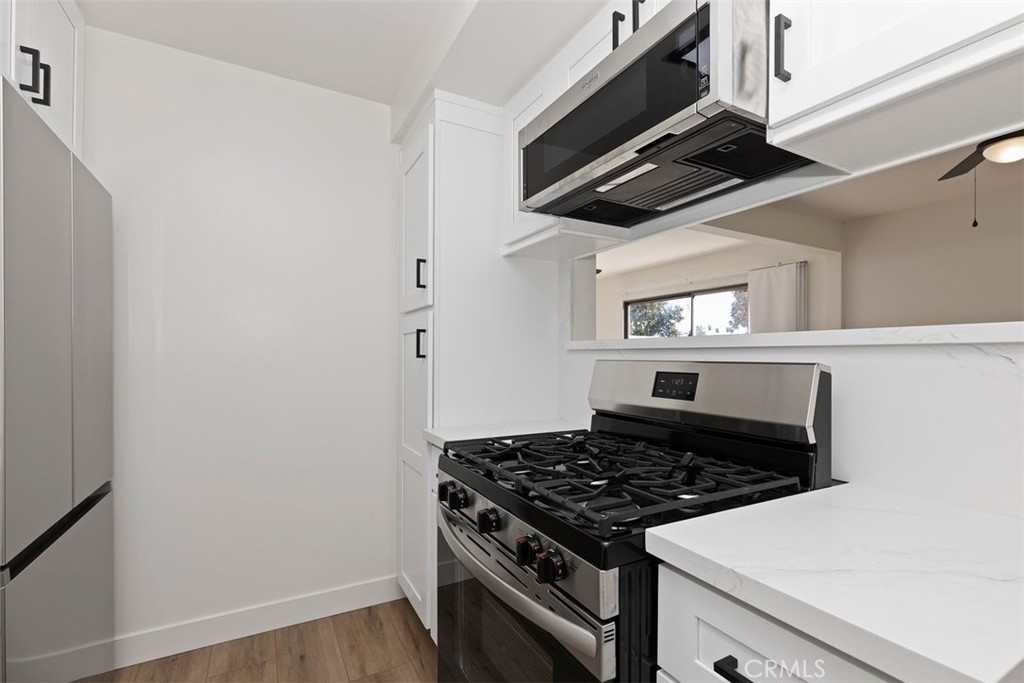 4807 Jackson Street, Unit D Riverside, CA 92503 - Photo 8 of 38 a stove top oven sitting inside of a kitchen