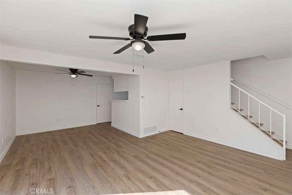 4807 Jackson Street, Unit D Riverside, CA 92503 - Photo 9 of 38 a view of an empty room with wooden floor