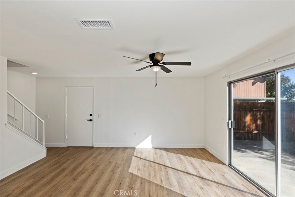 4807 Jackson Street, Unit D Riverside, CA 92503 - Photo 10 of 38 a view of empty room with wooden floor and fan