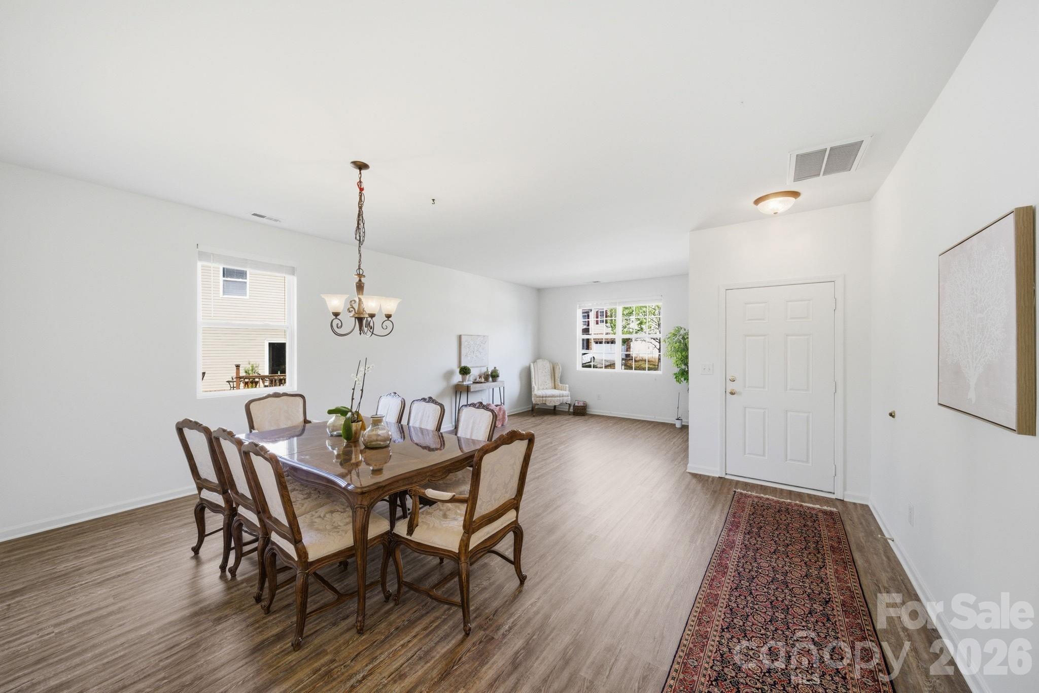 2306 Nettleton Court Matthews, NC 28105 - Photo 13 of 34 a view of a dining room with furniture and wooden floor