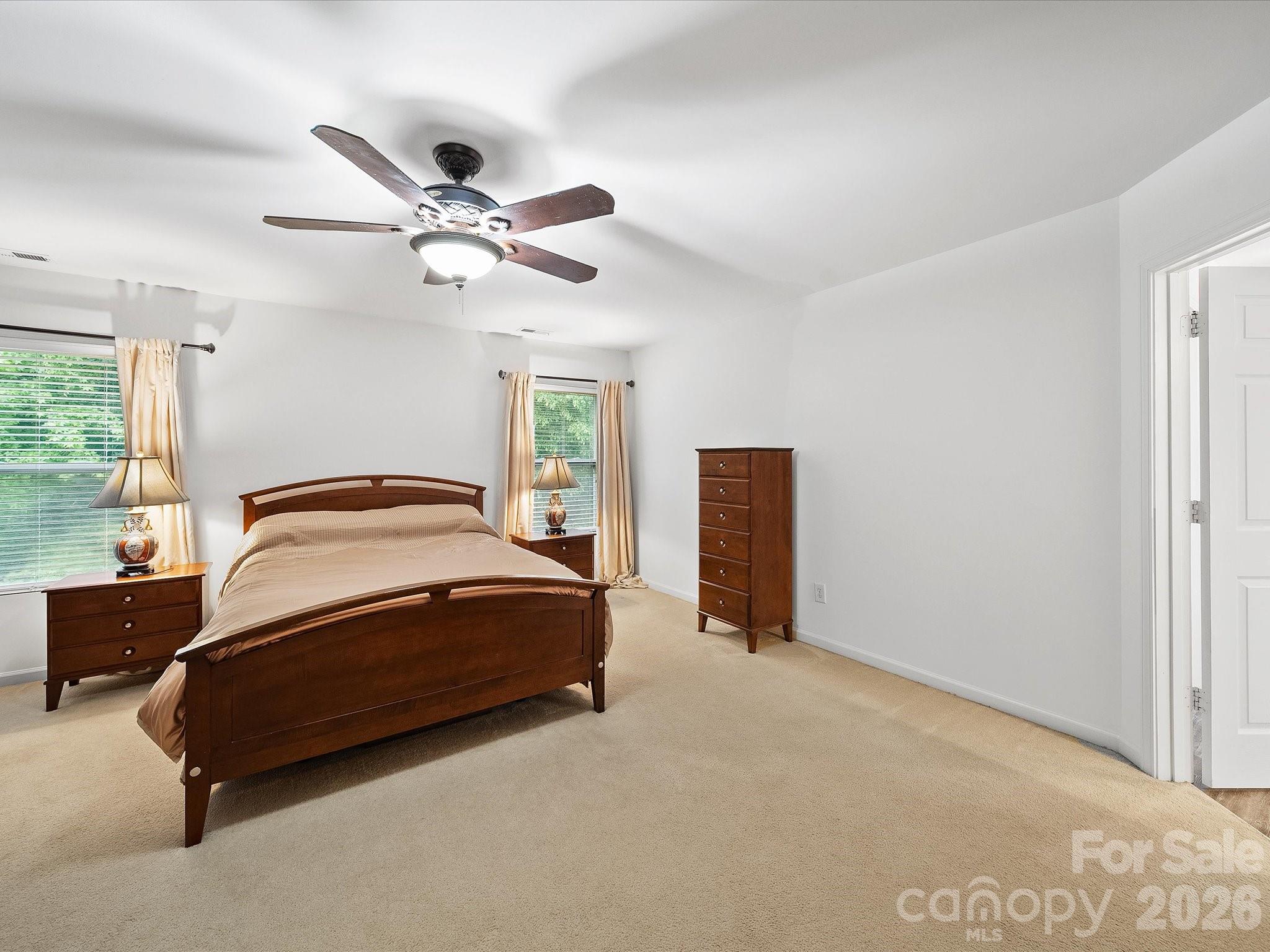 2306 Nettleton Court Matthews, NC 28105 - Photo 20 of 34 a bedroom with a bed and window