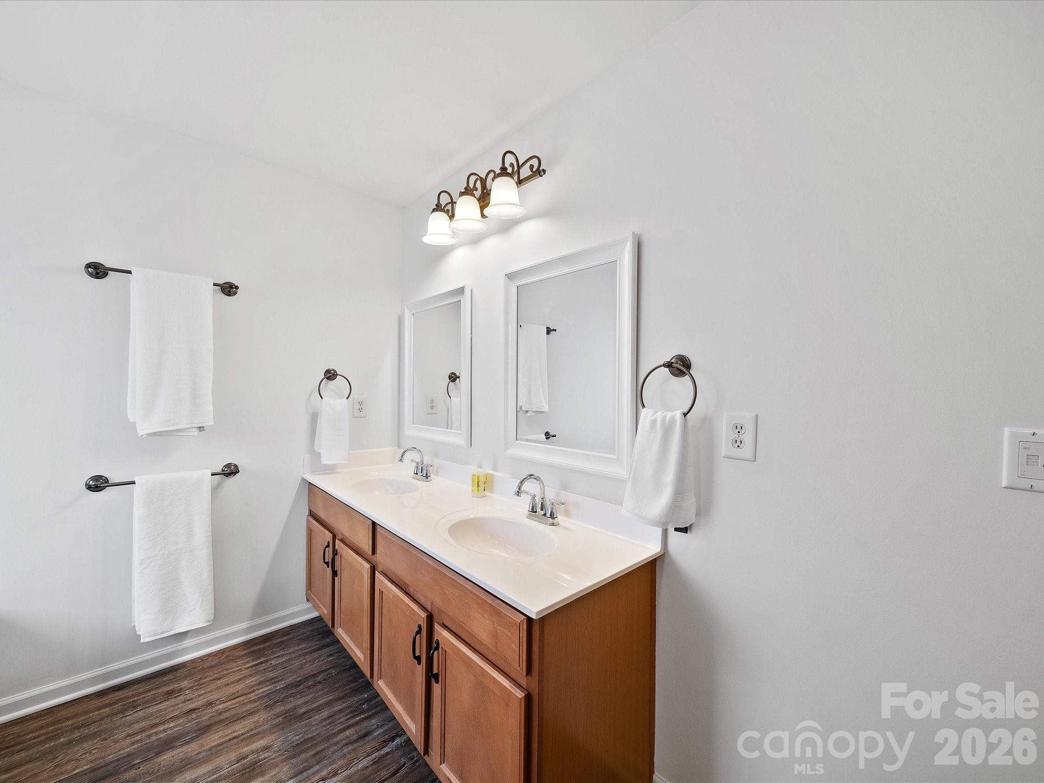 2306 Nettleton Court Matthews, NC 28105 - Photo 21 of 34 a bathroom with a sink and a mirror