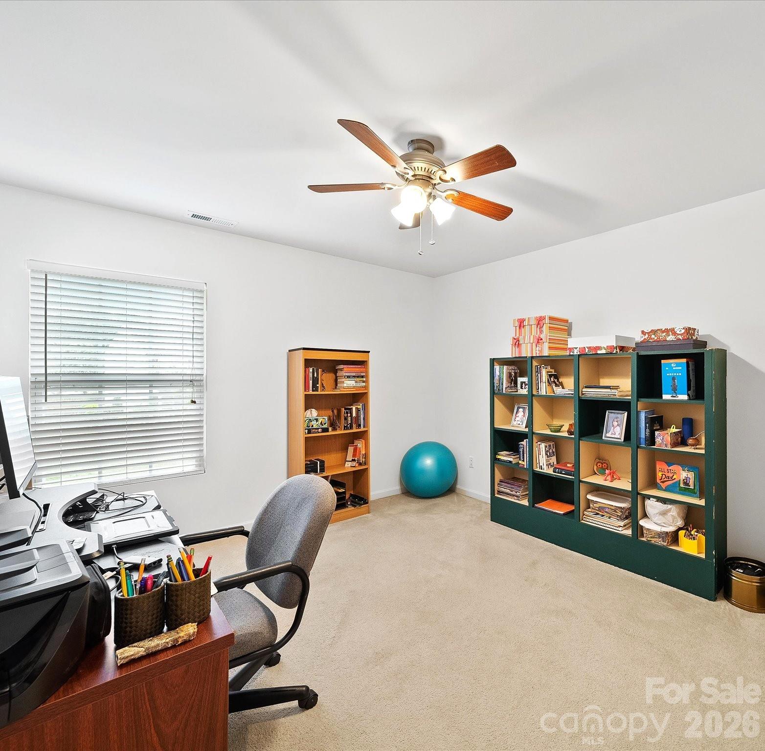 2306 Nettleton Court Matthews, NC 28105 - Photo 27 of 34 a view of a workspace with furniture and a window