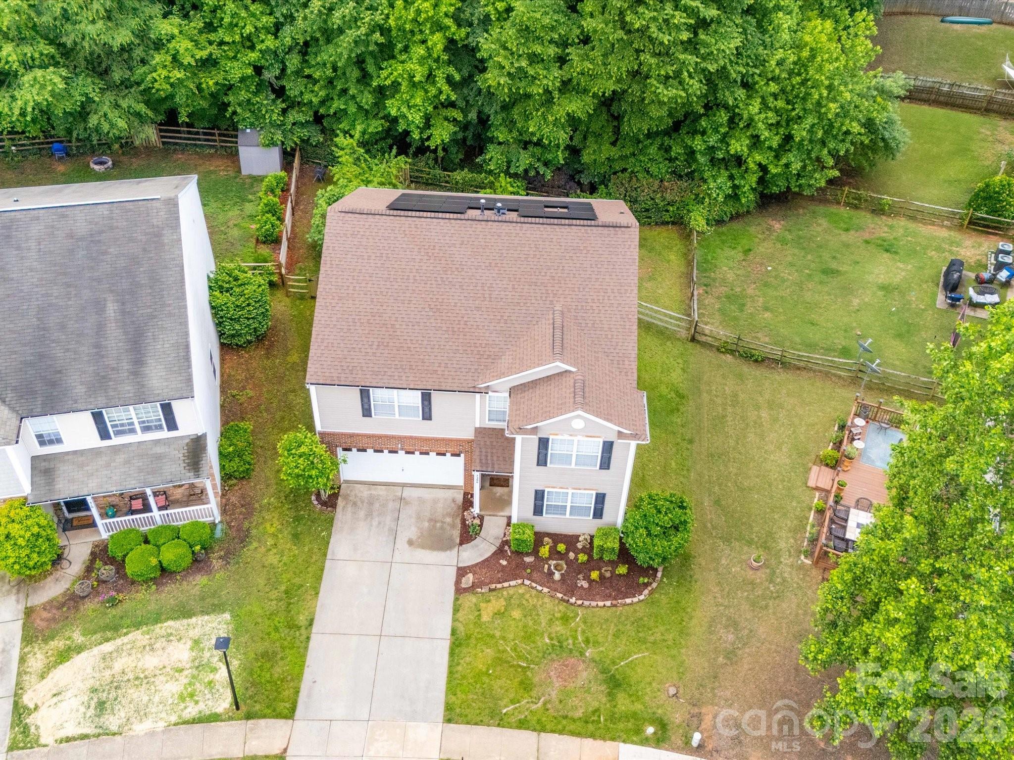 2306 Nettleton Court Matthews, NC 28105 - Photo 33 of 34 an aerial view of a house with garden space and street view