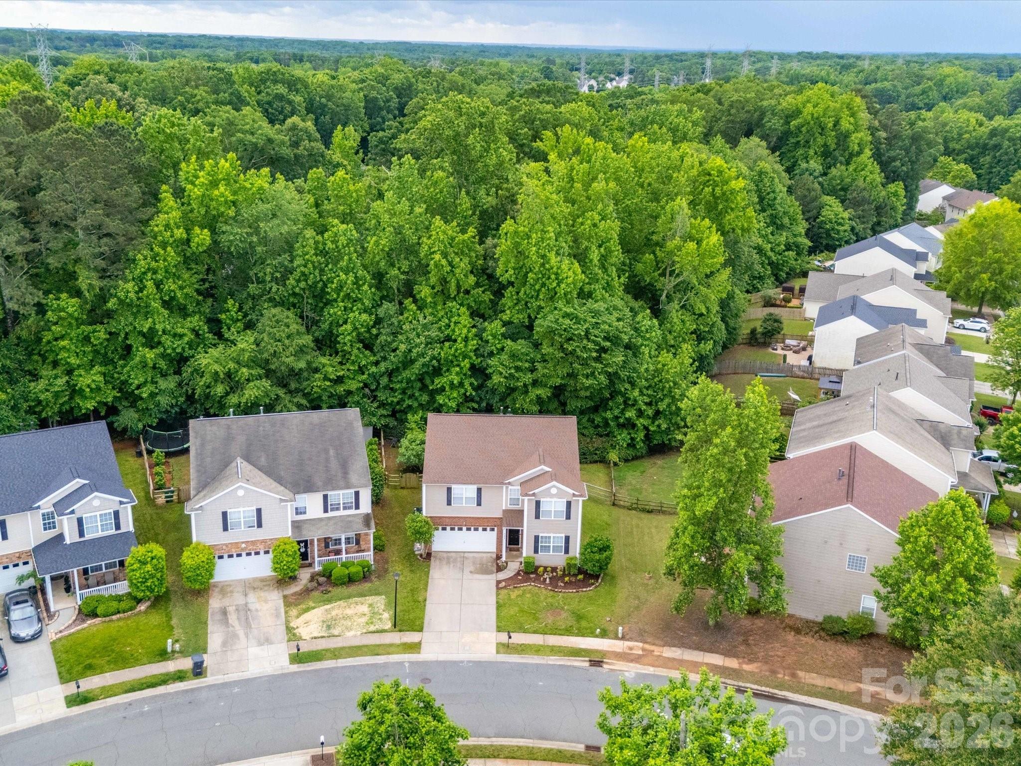 2306 Nettleton Court Matthews, NC 28105 - Photo 34 of 34 an aerial view of residential houses with outdoor space and trees all around