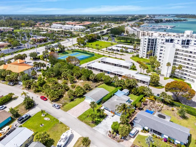 a view of a hallway with wooden floor and furniture