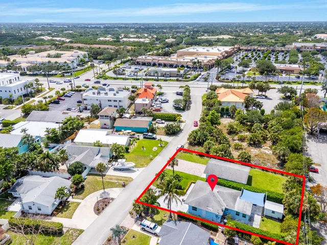 a bedroom with two beds and painting on the wall