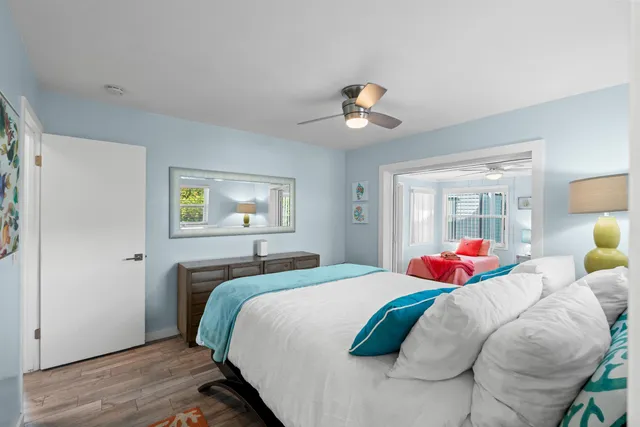 a bed room with furniture and a chandelier