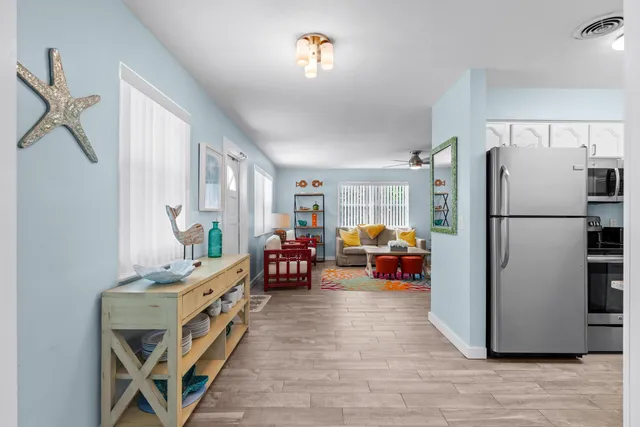 a view of a dining room with furniture and window