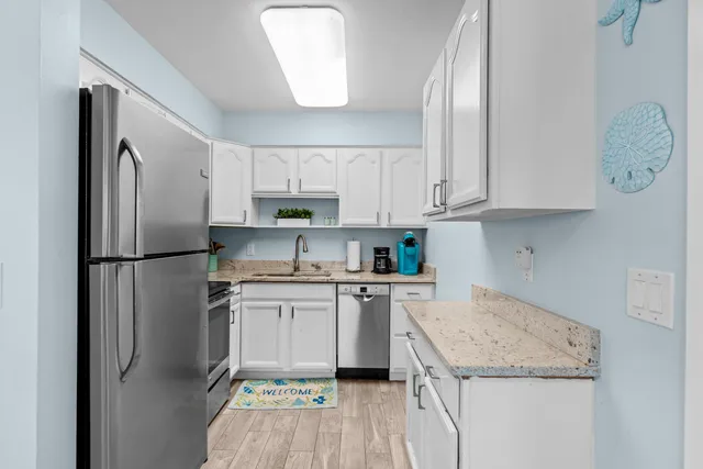a living room with furniture a large window and a flat screen tv