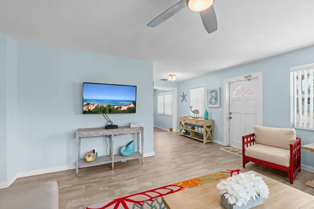 a view of a big yard with plants and large trees