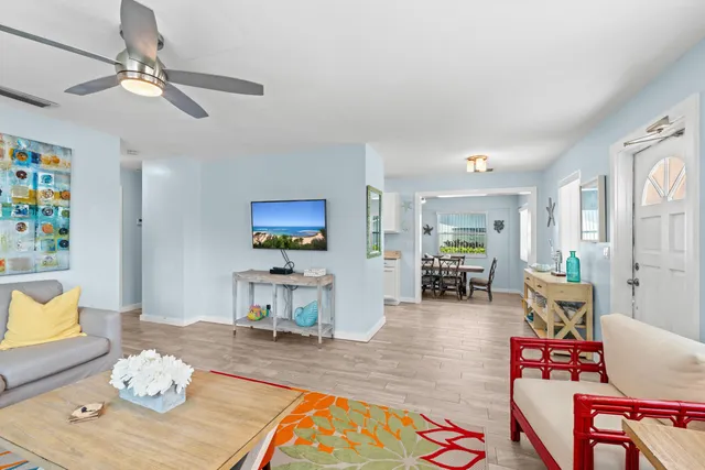 a view of backyard of house with green space