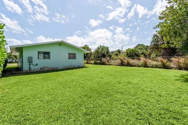 a backyard of a house with seating space