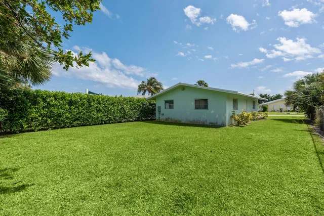 a house view with a garden space