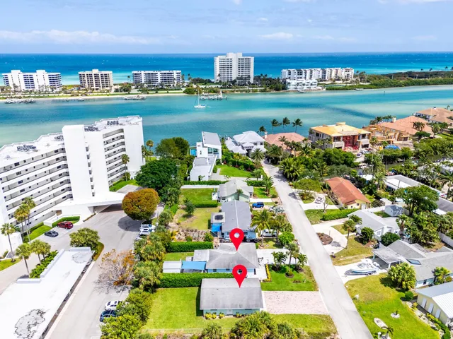 a aerial view of a city with lots of residential buildings ocean and ocean view