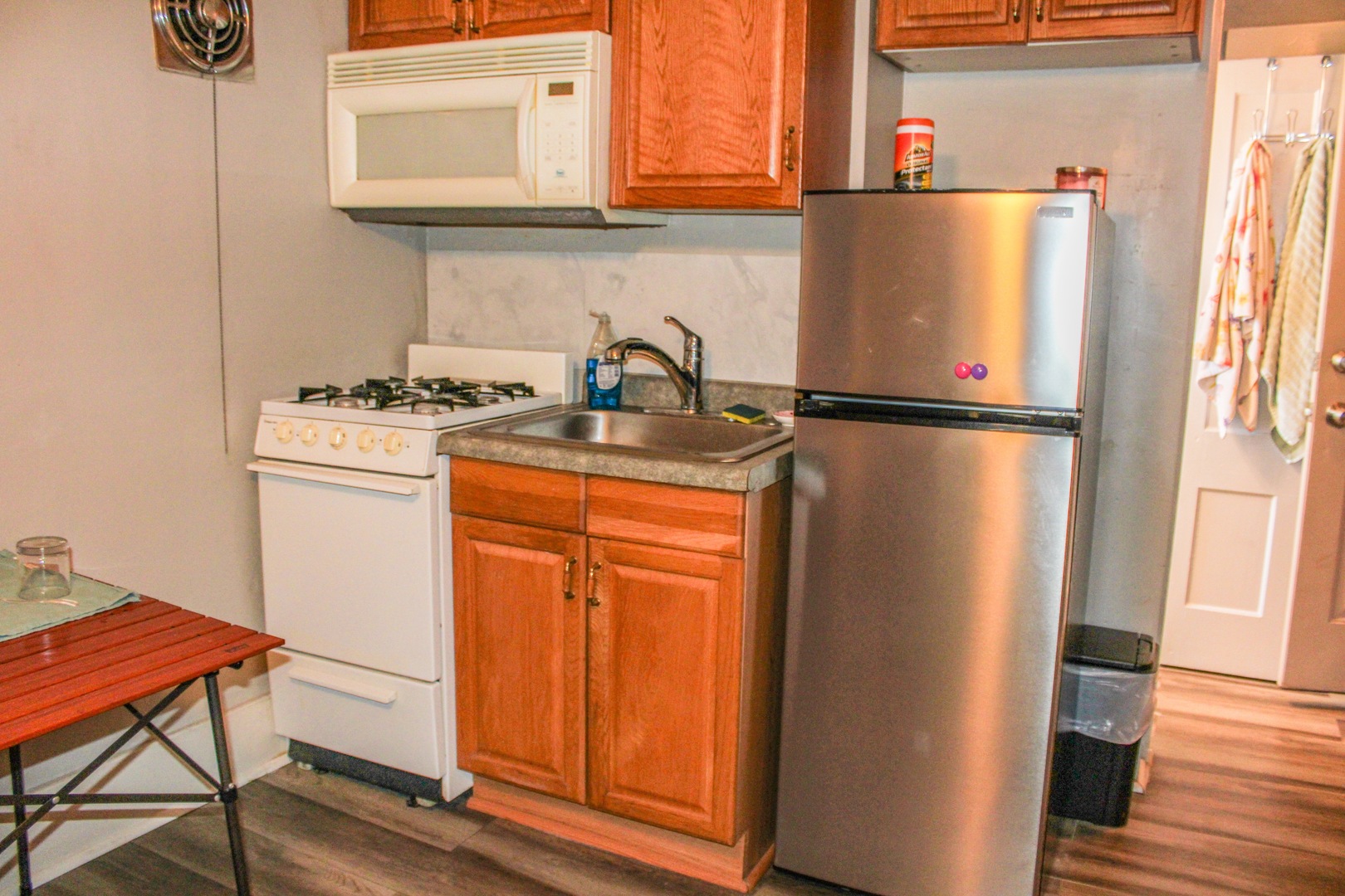 109 Cary Street Cary, IL 60013 - Photo 8 of 21 a white refrigerator freezer sitting inside of a kitchen