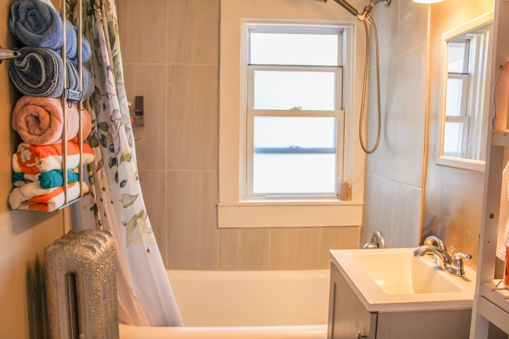 109 Cary Street Cary, IL 60013 - Photo 10 of 21 a bath tub sitting next to a white sink and a window