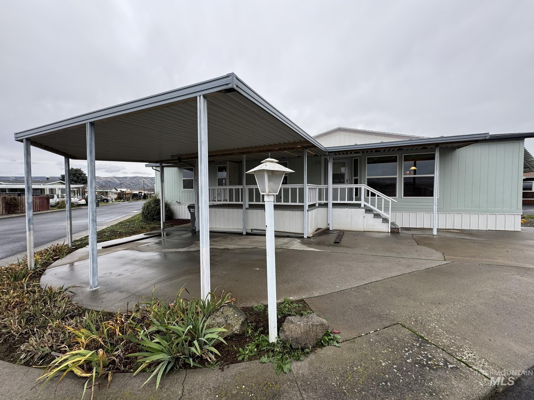 2015 6th Avenue, Unit 308 Clarkston, WA 99403 - Photo 29 of 39 View of vehicle parking featuring a carport