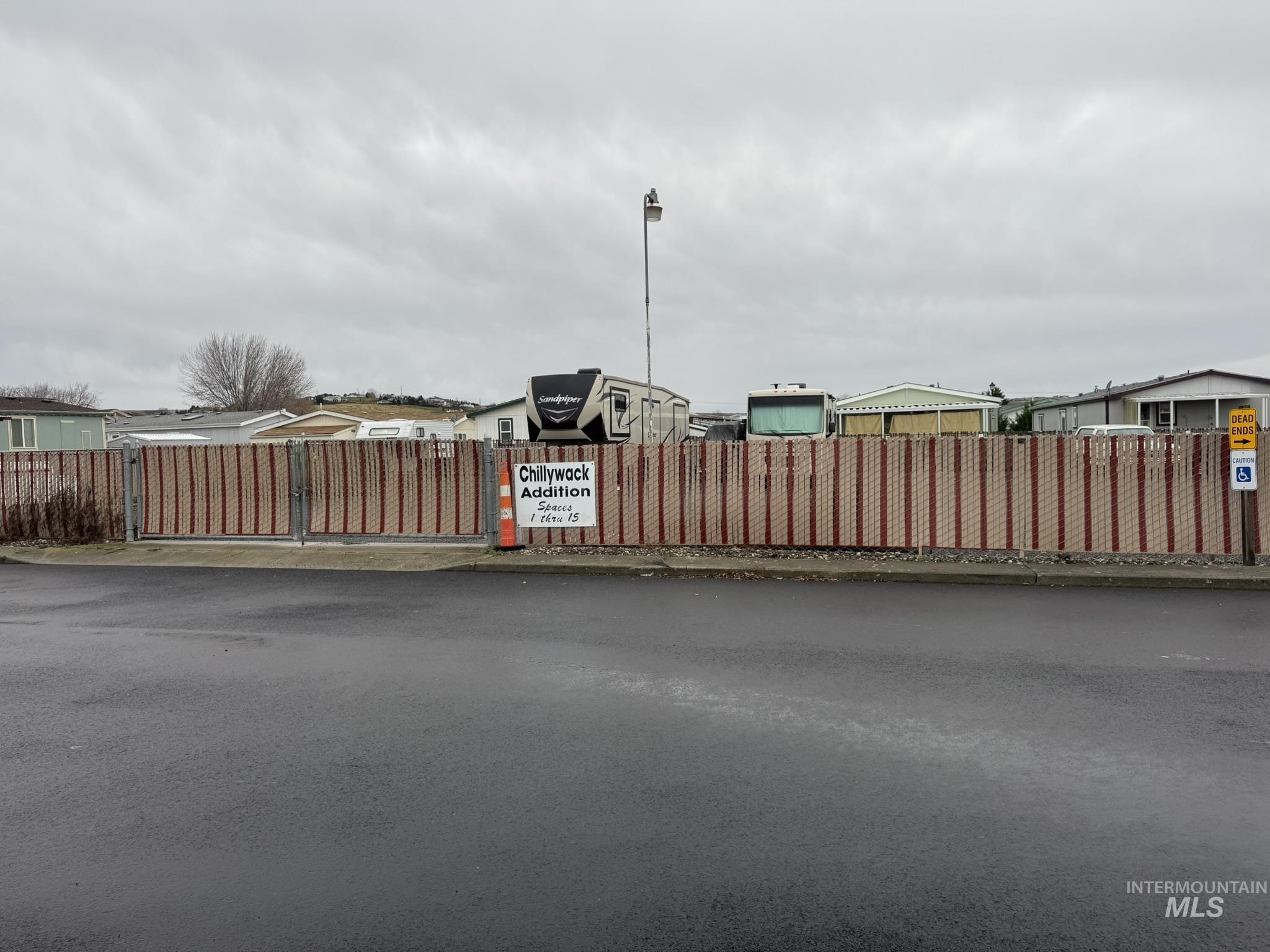 2015 6th Avenue, Unit 308 Clarkston, WA 99403 - Photo 34 of 39 View of asphalt street with street lighting and a gate