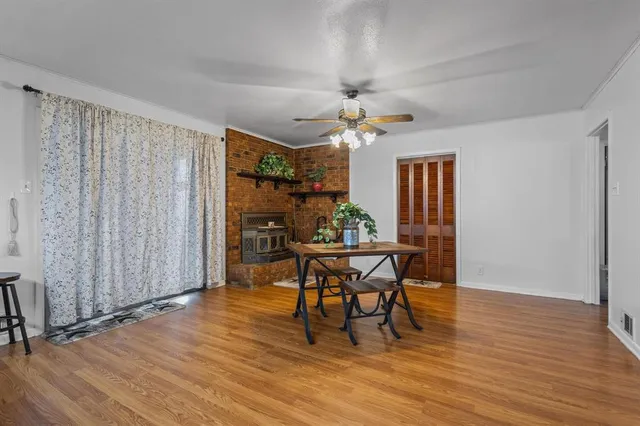a view of a dining room with furniture and chandelier