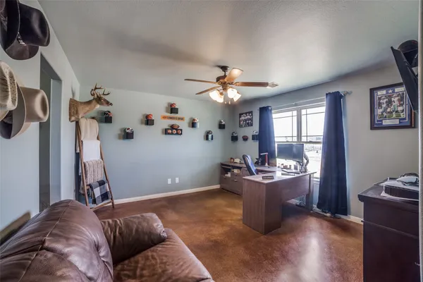 a living room with furniture and white walls
