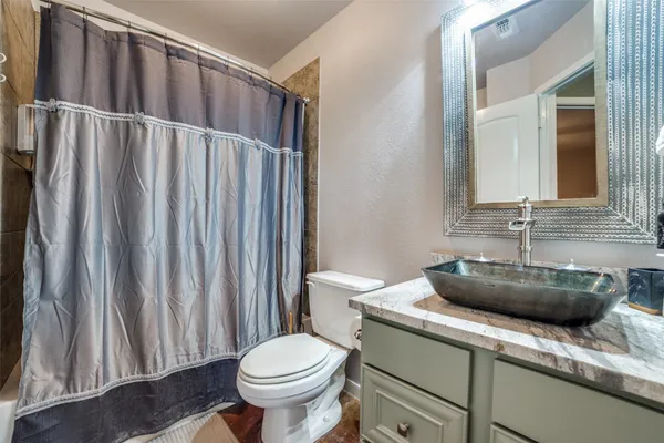 a bathroom with a toilet and a sink