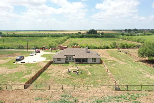 a view of a swimming pool and an outdoor seating