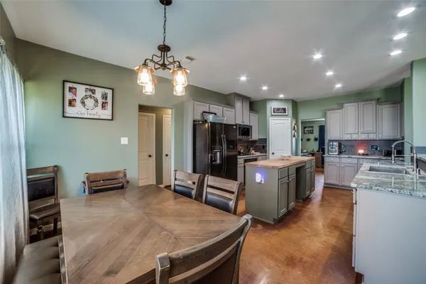 a kitchen with kitchen island granite countertop lots of counter top space
