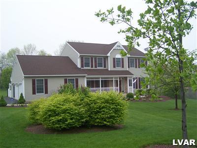185 West Butternut Road Hellertown, PA 18055 - Photo 1 of 11 a front view of a house with a garden