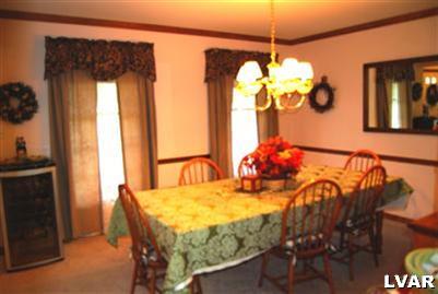 185 West Butternut Road Hellertown, PA 18055 - Photo 4 of 11 a view of a dining room with furniture and a chandelier