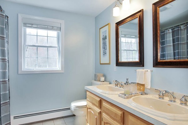 9 Sidney Road Sturbridge, MA 01566 - Photo 24 of 30 a bathroom with a granite countertop sink a toilet and a window