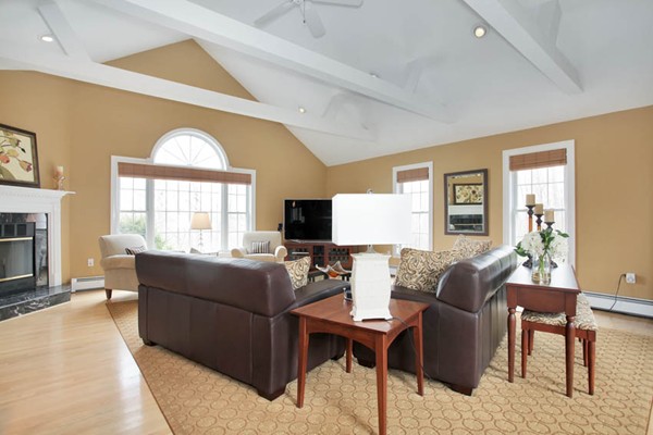 9 Sidney Road Sturbridge, MA 01566 - Photo 4 of 30 a living room with furniture a fireplace and a large window