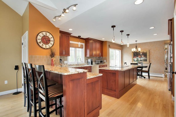 9 Sidney Road Sturbridge, MA 01566 - Photo 6 of 30 a kitchen with granite countertop a table chairs a stove a dining table and chairs